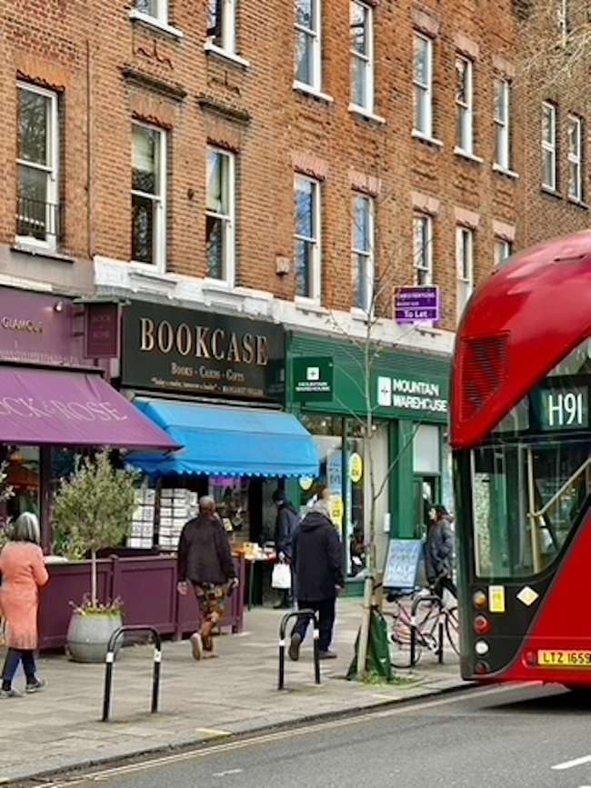 shop windows and restaurants along Chiswick High Road.